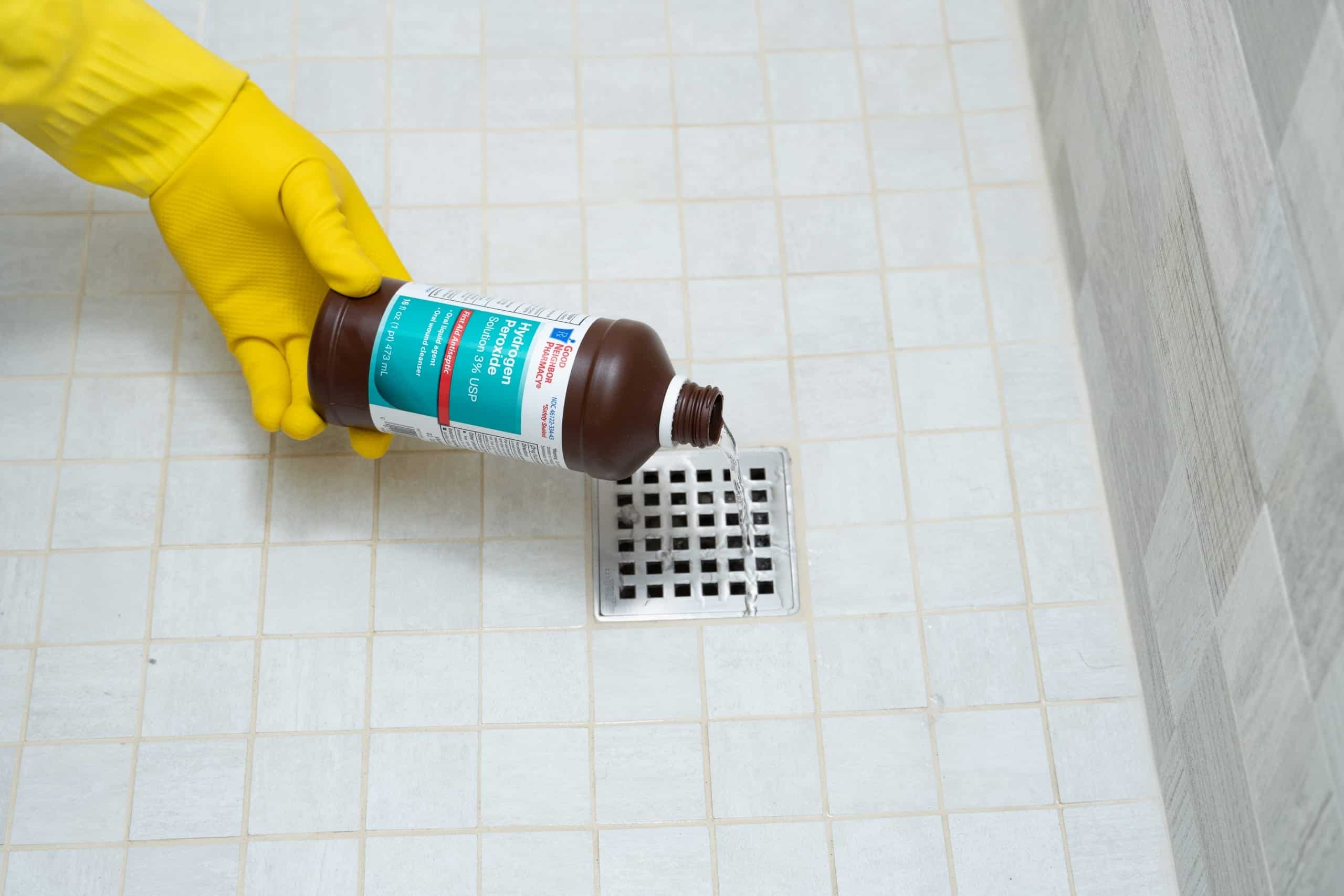 cleaning bathroom drain with hydrogen peroxide to remove odors